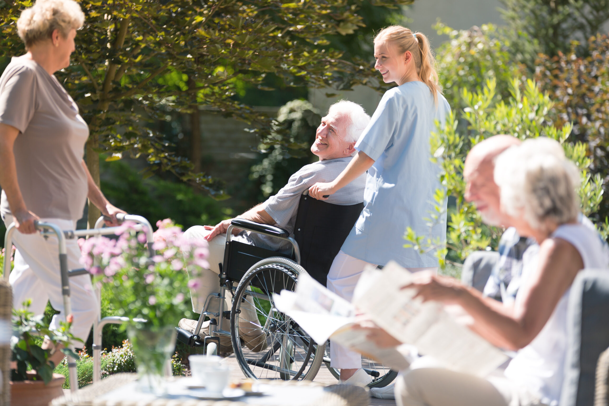Nurse supporting senior man